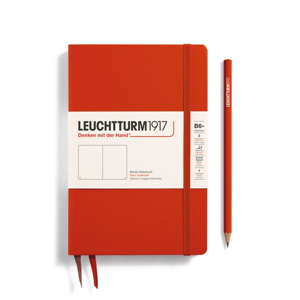Fox red hardcover blank notebook with 2 bookmarks, with thin fabric strap closure.